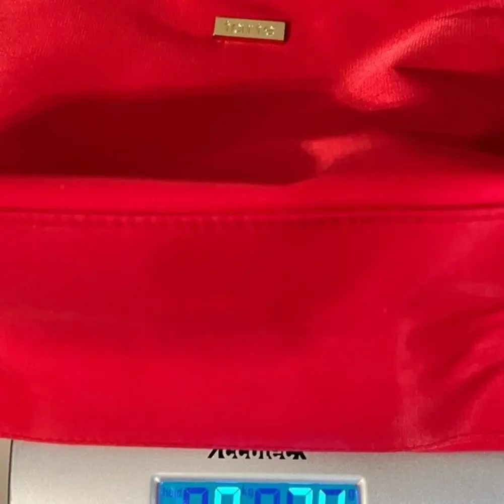 Tarte red cosmetic bag/ clutch, nice size with beautiful purple satin interior